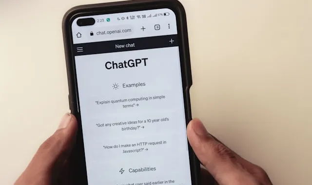 A person using ChatGPT on a phone to ask for a recommendation, representing how buyers now search with AI